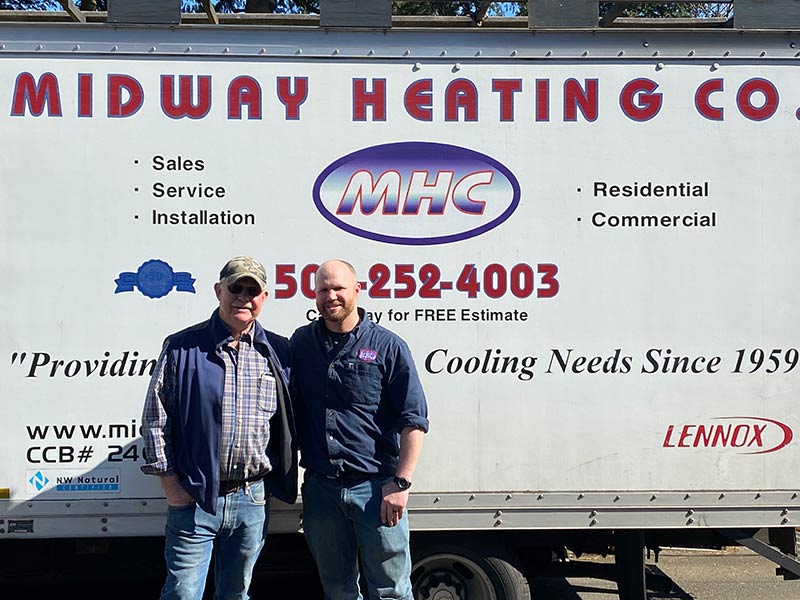 Midway Heating Company team photo in front of truck